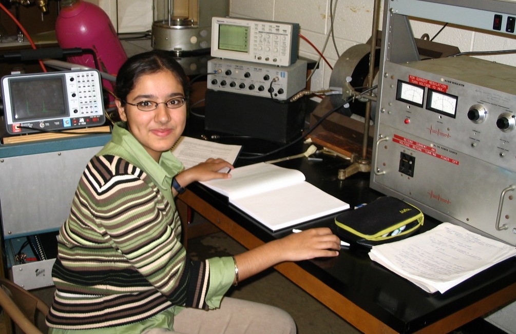 Photo of student working on older NMR Experiment.