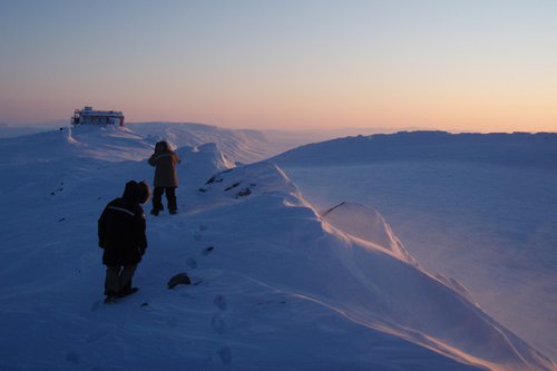 Researchers Joseph Mendonca and Debora Griffin Hiking in the Arctic