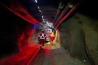 SNOLAB staff escort the dilution fridge 1.2 kilometers through the mine drift to the lab entrance.