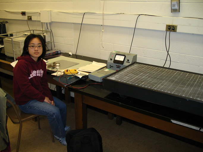 Photo of Eugenia Tam, a third year Engineering Sciences Physics Option student, working on Conductivity in Three Dimensions