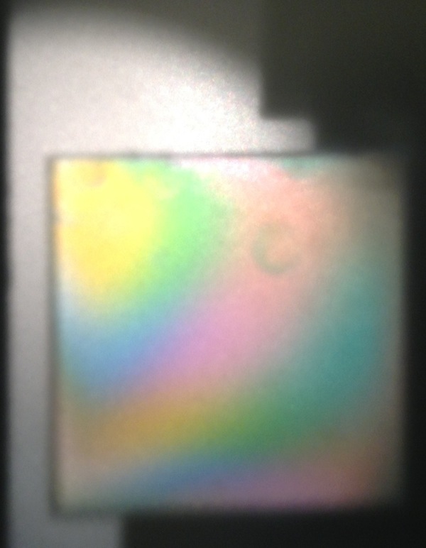  Photo of broad white light fringes.